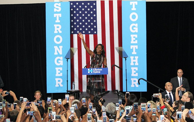 First Lady Michelle Obama waves to the crowd at the Johnson Center, George Mason University on Friday, Sept. 16.

