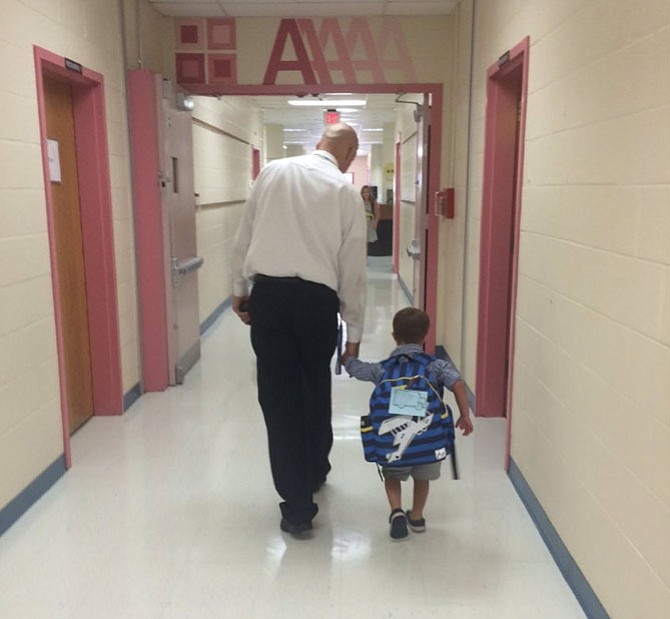 This photo of Crossfield Elementary Principal Mark Granieri with a kindergarten student was taken on the first day of school and captured the hearts of 2,200 fans on FCPS' Facebook page. Teacher Erin Snell captured the moment.
