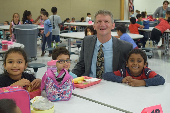 New Coates Elementary School Principal Jesse Kraft interacts with students.
