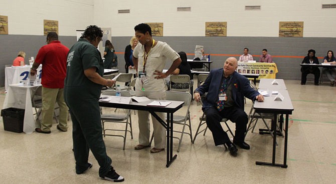 Whittina McLilly, Re-Entry and Family Services Program Manager with OAR (Opportunities, Alternatives and Resources), speaking with an inmate at the fourth Inmate Resource Fair at the Fairfax Adult Detention Center. 
