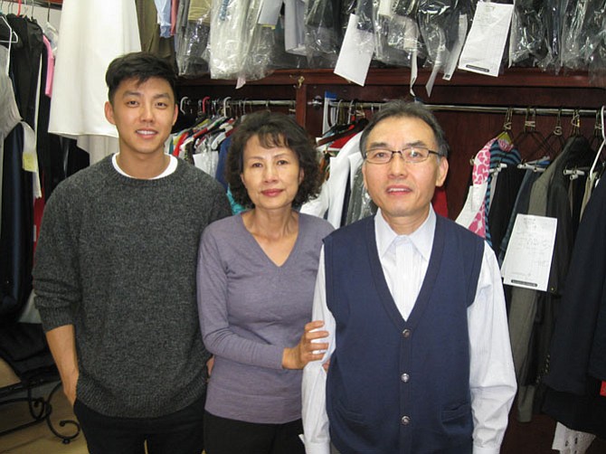 David Deuk Kim (right) with his son Philip and wife Soon Kim of Kim's Tailoring, located in the Great Falls Center Shopping Center on Georgetown Pike in Great Falls.
