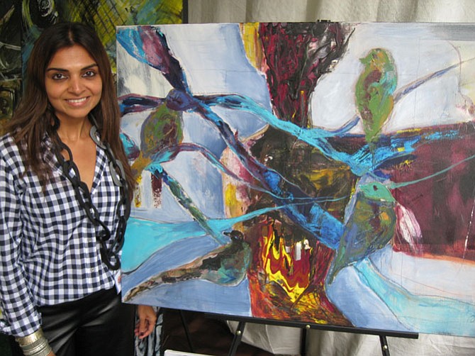 Sweta Shah of Vienna shows her piece, Freedom, an acrylic on canvas.