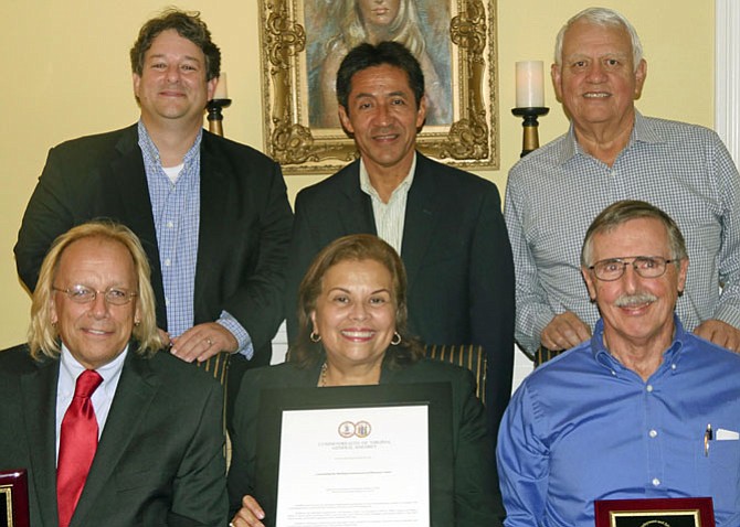 Back from left: Alfonso Lopez, Walter Tejada, Andres Tobar (executive director). Front: Charles Meng, Leni Gonzalez (chair of the SEEC Board) and Bill Murphy. 
