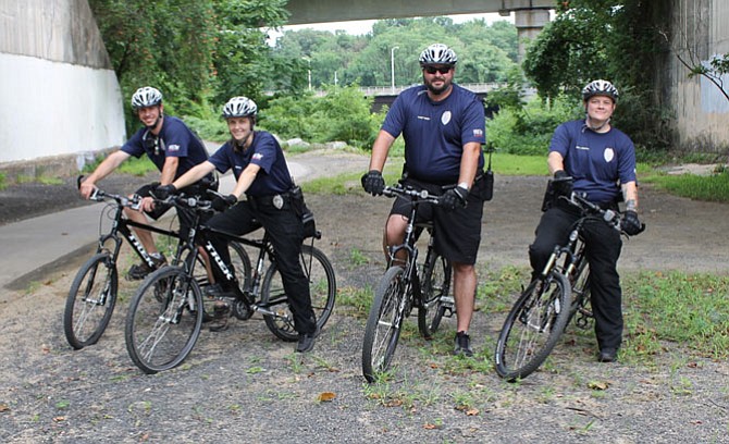 Animal Welfare League of Alexandria’s Chief of Animal Services Brian Rees (second from right) with his bike patrol team (from left): Ken Howes, Megan  Boyd and Tammy Doran.

