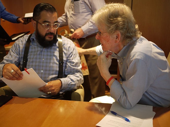 Richard Merritt and Neighborhood Health’s Eduardo Mantilla-Torres discuss follow up care. 
