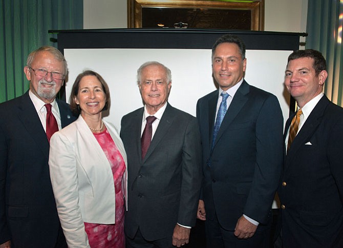 From left are John Milliken, APAH board chair and master of ceremonies; Nina Janopaul, president and CEO of APAH; David C. Leibson, co-chair of the Arlington Ten-Year Plan to End Homelessness, and APAH 2016 honoree; Timothy J. Naughton, CEO of AvalonBay Communities and APAH 2016 honoree; and Jay Harris, APAH board of directors member.
