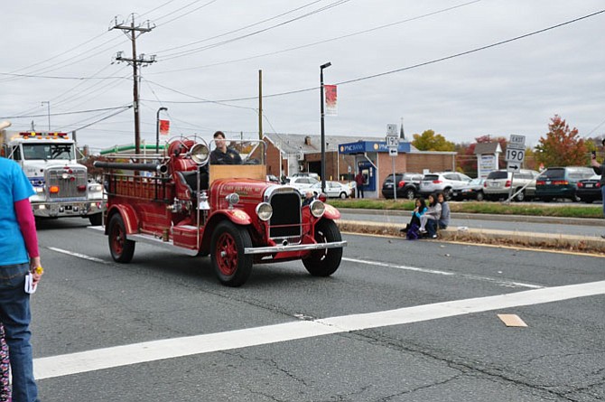 The Cabin John Park Volunteer Fire Department participates in the Potomac Day parade with its classic apparatus ...
