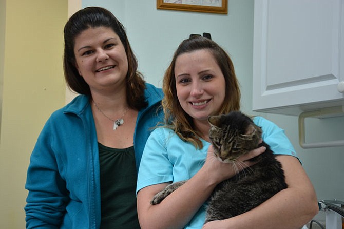 Dr. Jennifer Bowles Viergutz of Springfield (left) owns Burke Forest Veterinary Clinic, where Elizabeth Exline of Burke (right) has worked for nine years. Exline changed careers to work at the clinic and recently completed a veterinary certification program to become a licensed technician.