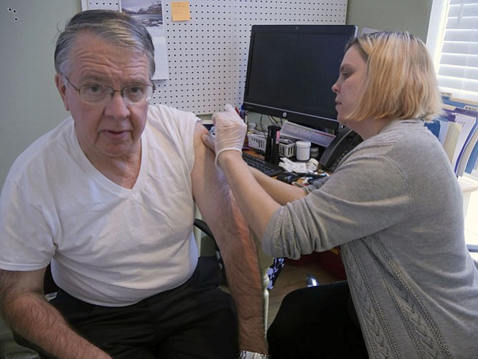 Keith Stalder, a regular customer at The Neighborhood Pharmacy, has come in for a flu shot. He says this is the way every business should be run. “These small pharmacies are almost non-existent.”
