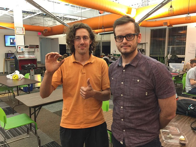 From left -- Mike Hogarty, owner of Hotrods 2 Hybrids joined with Callye Keen from Red Blue Collective to create Alpha, a new fidget toy. Photo taken at the Nova Labs site in Reston.

