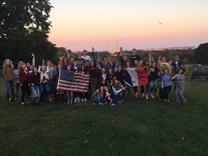 The group of students and teachers from Reims, with American friends, watched a sunset near the Iwo Jima Memorial.