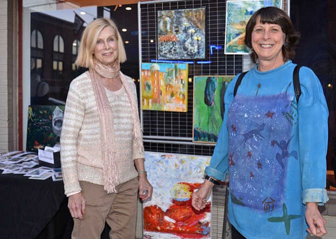 From left -- Showing off her artistic talent in front of Copan Restaurant was artist Livingston Rodgers with “crawler” Virginia Glenn of Great Falls. Glenn already owns at least one piece by Rodgers, but looked ready to add to her collection.
