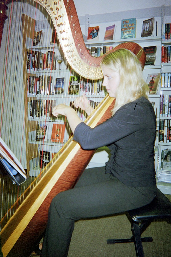 Harpist Francesca Savoia of Vienna plays for guests at the Dolley Madison Library. 