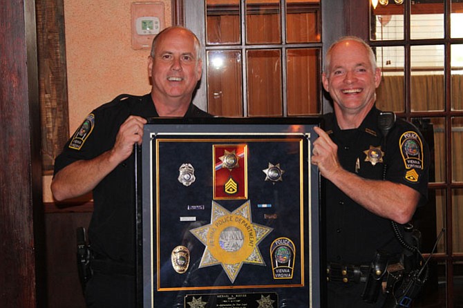 From left – Colonel James A. Morris presents Shadow Box to SGT Michael Reeves.
