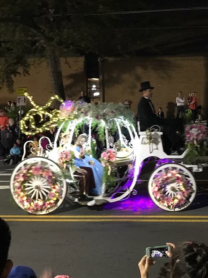 Karin’s Florist decorated a Cinderella “pumpkin” carriage for Cinderella and her prince to ride in … along with 8-year-old Abby Hamm who was voted by the community as the parade’s very own little princess.