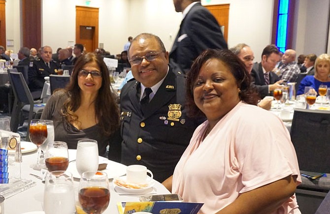 Alexandria Police Chief Earl Cook, flanked by his daughter Crystal Johnson, right, and APD division chief Brenda D’Sylva, celebrates his retirement at a luncheon Sept. 30 at the Westin Alexandria Hotel.