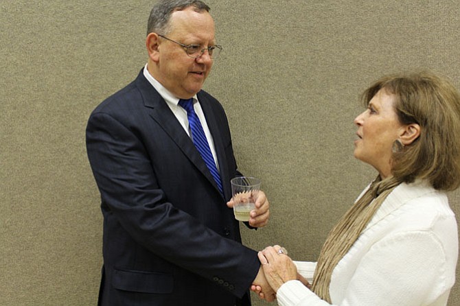 McLean Citizens Association Board Member Bonnie Heebner, who represents Madison of McLean, congratulates Mark Zetts on his resolution. “He was very informative, knowledgeable. I learned a lot from him,” she says of Zetts.


