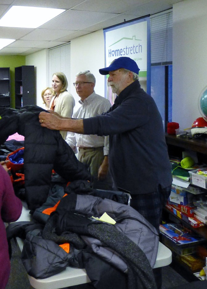 Arlington Rotary Club members give winter coats to children enrolled in Homestretch.