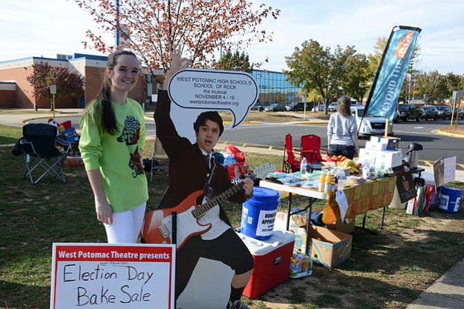 West  Potomac junior McKenna Wirth (left) advertises the current school musical “School of Rock” on Election Day while raising money to support the school’s Beyond the Page Theatre Co.’s upcoming trip to Edinburgh, Scotland Fringe Festival to perform “Rock of Ages 101.”