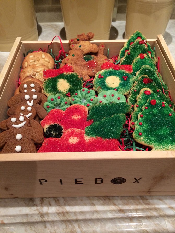 Terri Carr bakes, decorates and packages holiday cookies, which she sends to friends and family.