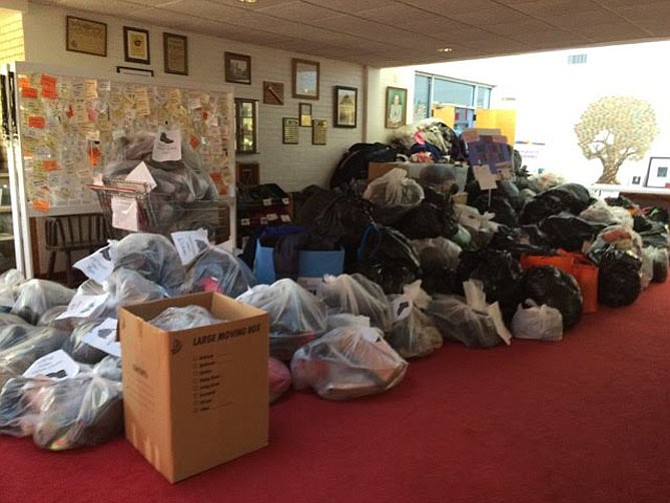 Coat donations pile up at one of LINK’s previous coat drives. In 2015 the coat drive provided 2,900 used winter coats, gloves and mittens to 400 families.
