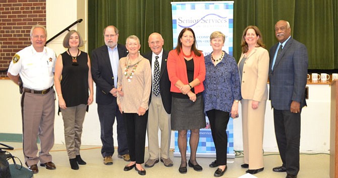 Volunteers and staff of Senior Services of Alexandria gather with city officials at the SSA Volunteer Appreciation luncheon Nov. 3 at the Durant Arts Center. From left: Sheriff Dana Lawhorne; Friendly Visitor of the Year Alexandra Johnson; Education Volunteer of the Year Steve Cordle; Meals on Wheels Volunteers of the Year Bobbie and Patrick O’Brien; Groceries to Go Volunteer Carolyn Caine; SSA Executive Director Mary Lee; Mayor Allison Silberberg; and SSA Board Chair Lynwood Campbell.