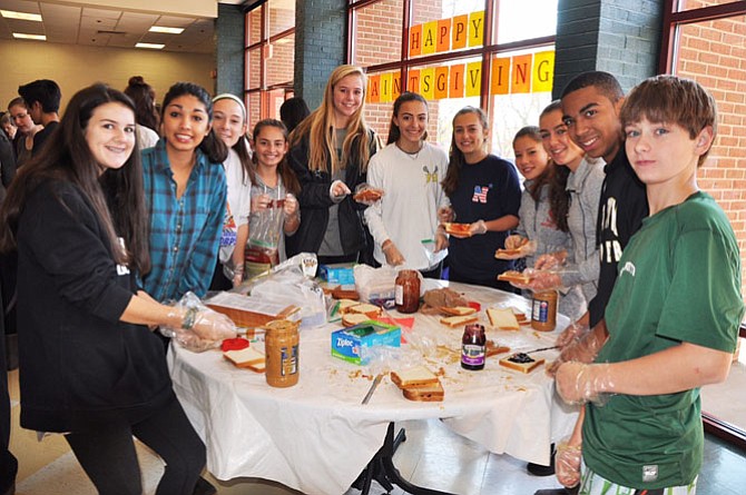 On the day before Thanksgiving 2015, students at St. Stephen’s and St. Agnes School make sandwiches for the homeless.