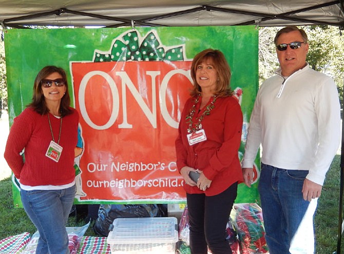 From left are Nicole Rogers, Kelly Lavin and John O’Neill at the Our Neighbor’s Child booth at Centreville Day.