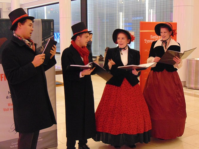 The 42nd Street Singers performs Christmas Carols inside Tysons Corner Center Mall.
