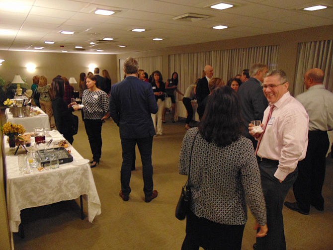 Guests mingle during the Cocktails for a Crowd fundraiser sponsored by the New Dominion Women's Club of McLean on Thursday, Nov. 17, 2016, at the Party Room in the McLean House in McLean.
