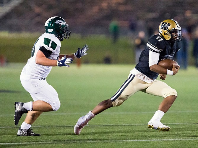 Westfield QB Rehman Johnson #17 carries  the ball  against the South County defense