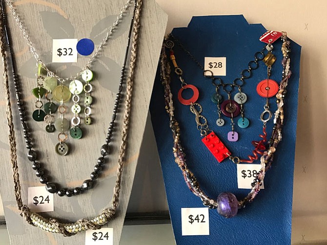 Karen L. Klein is the creator of this jewelry. She created SCRAP DC — a creative reuse center. Her jewelry comes from many purchases she made from reusable materials.