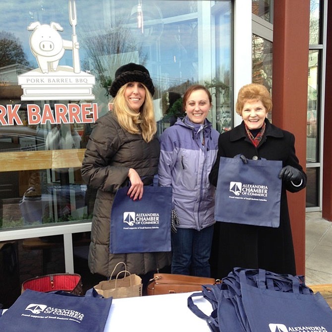 Councilwoman Del Pepper, right,  joins Shari Simmans and Maria Ciarrocchi of the Chamber of Commerce at last year’s kick off to Small Business Saturday. The Chamber will again be handing out goodie bags with surprise gifts at Market Square from 9 a.m.-noon and in front of Pork Barrel BBQ from 12:15-1:15 p.m. on Nov. 26.