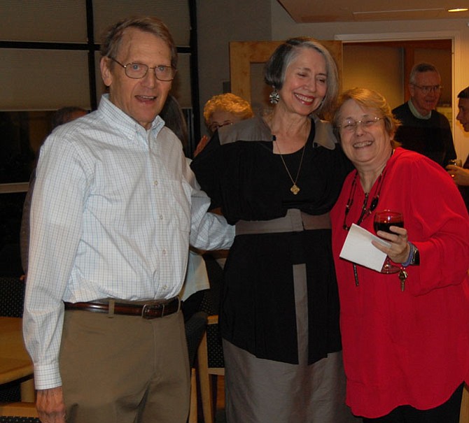 Anna Schalk, center, enjoyed speaking with two fellow Montebello residents, Mitch Levy, left, and Regina Ryder, at a reception celebrating Schalk’s portraits of friends.