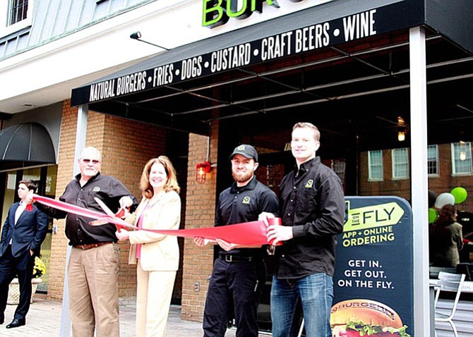 Alexandria Mayor Allison Silberberg and BurgerFi Alexandria owners (from left) Dave Landry, Chris Landry and Tim Kelly at the ribbon cutting for the restaurant’s grand opening.
