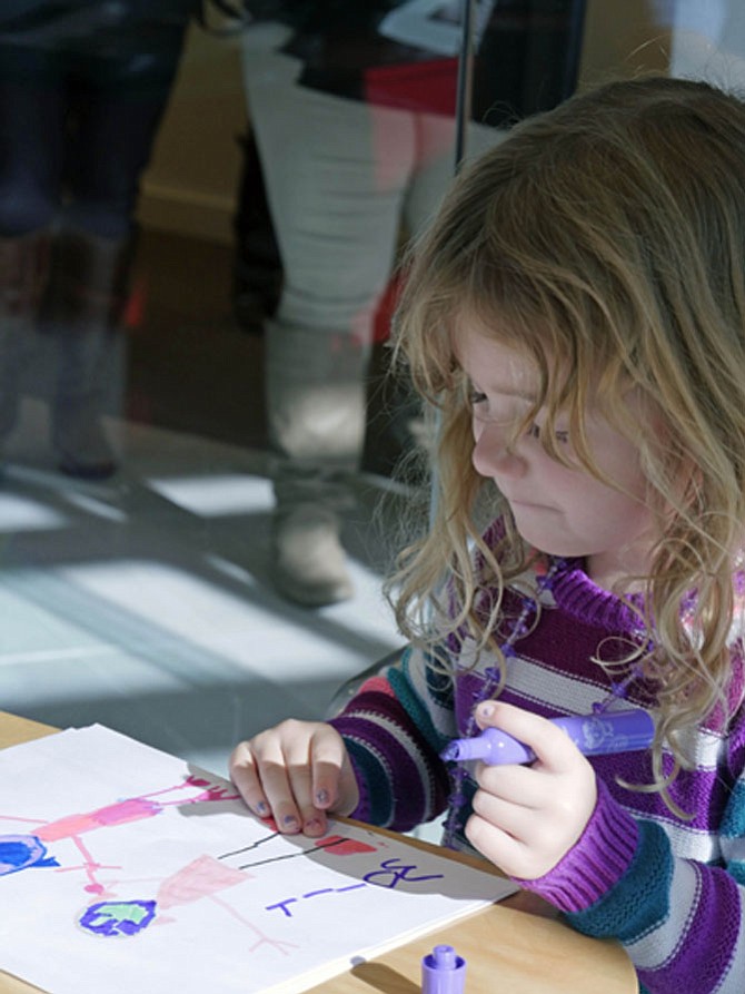 Molly Welch and three other volunteers are making Thanksgiving cards to accompany each dinner. Molly says her picture is for another 4-year-old girl who doesn’t have money for a Thanksgiving dinner. 
