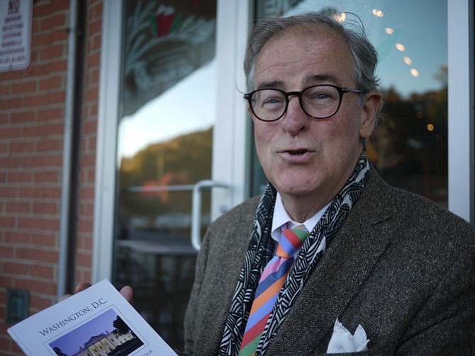 Jake McGuire holds his book of photographs which has come into its own as a gift item during the inaugural year. 