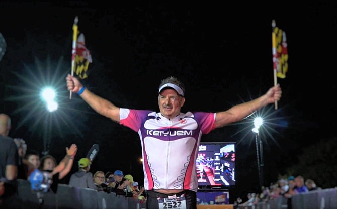 Coming up to the “gauntlet” home stretch, Bill Vitaletti of Springfield grabbed a pair of Maryland state flags and unfurled them as he ran across the finish of his first Ironman triathlon.
