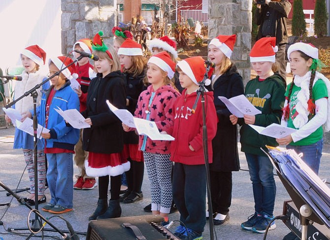 The Fairfax Choral Society Lyric Choir sings Christmas carols last December at Old Town Square.


