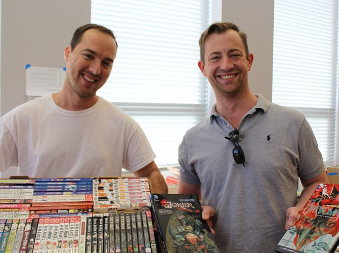 Jacob Pereira and Michael Peterson display some of the manga and comic books available during the sale. The sale will also have a large sci-fi, WWI, II and Civil War Section and fiction literature.
