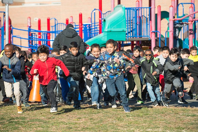 Second graders at Mount Vernon Woods Elementary ran two laps on Wednesday, Nov. 23; the girls went first followed by the boys (above). The Turkey Trot event was organized by Natalie Dorssett and Clint Waybright, the school's physical education specialists. 
