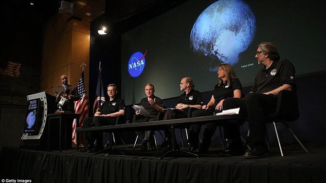 Dr. Michael Summers speaking at a NASA press conference about the New Horizon mission.