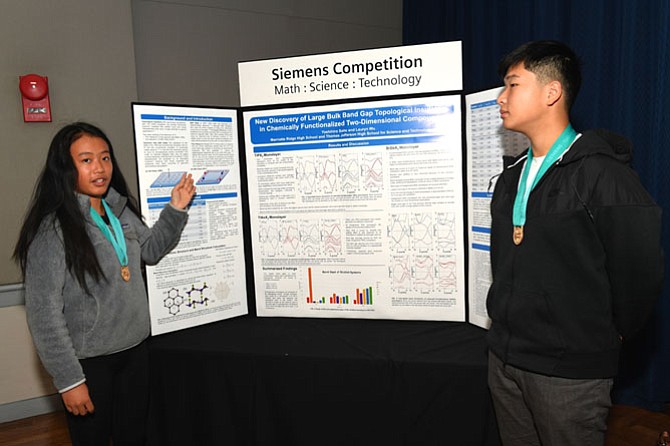 McLean’s Lauryn Wu, sophomore at Thomas Jefferson High School for Science and Technology in Alexandria, and Yoshihiro Saito, sophomore at Marriotts Ridge High School in Marriottsville, Md., present their project, “New Discovery of Large Bulk Band Gap Topological Insulators in Chemically Functionalized Two-Dimensional Compounds," to judges in D.C.