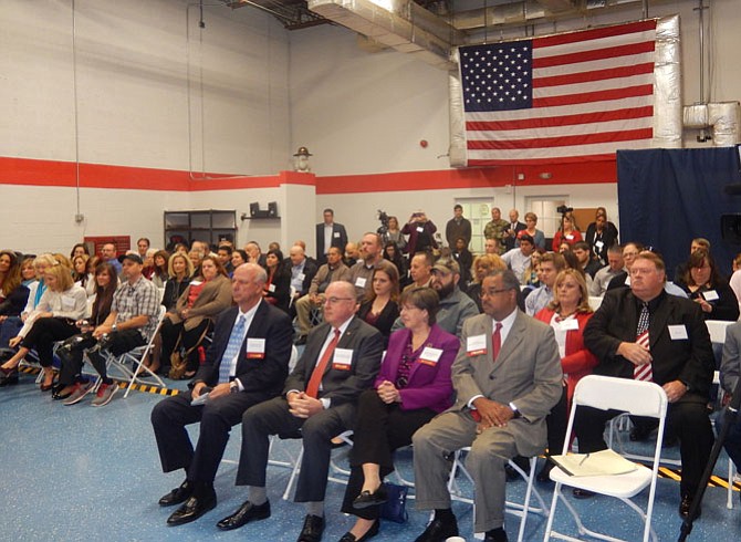 Among the crowd, in the front row, are (from left) Gerald Gordon, John Harvey Jr., Kathy Smith and Antonio Doss.