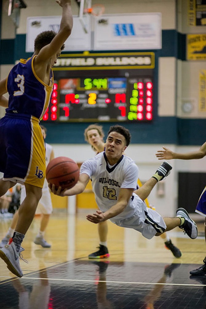 Jordan Hairston #12 goes underneath a Lake Braddock defender