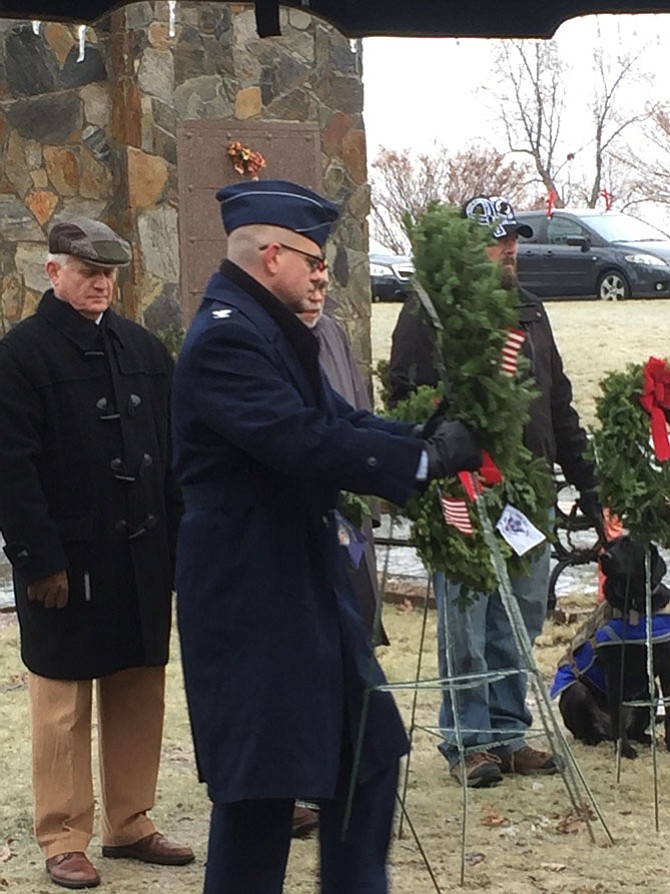 Colonel Alan Chambers, US Air Force, 779th Surgical Operations Squadron Joint Base Andrews, Fort Belvoir and Walter Reed, lays a remembrance wreath in memory of those who served and are serving in the United States Air Force during National Wreaths Across America Day held at Chestnut Grove Cemetery, Herndon, Saturday, Dec. 17. 