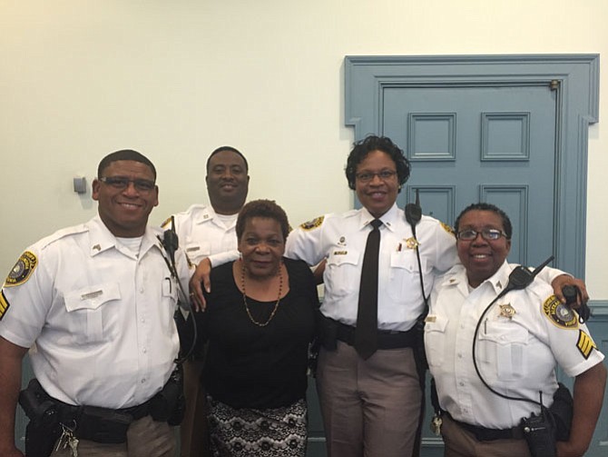 Sheriff's deputies, who are the court supervisors, congratulate Clerk of Courts Marion Jackson. From left are Sgt. Larry Richardson, Capt. Shelbert Williams, Lt. Melissa Josiah, and Sgt. Debra Hall.