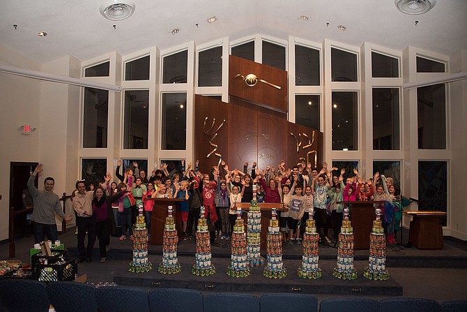 On Dec. 13, Hebrew School students at Temple B’Nai Shalom in Fairfax Station prepared for Chanukah by building a menorah from canned food.