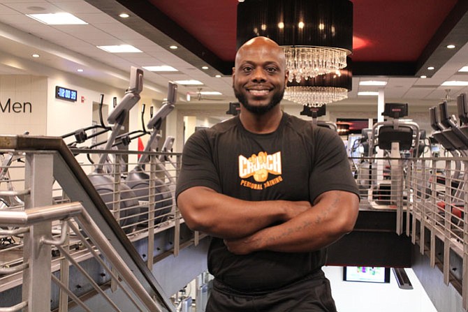 Crunch Fitness Reston Town Center Fitness Director Cali Garner, who stands at 5 foot and 7 inches, made a fitness resolution in 2009 that helped him go from 255 pounds to 189 pounds.

