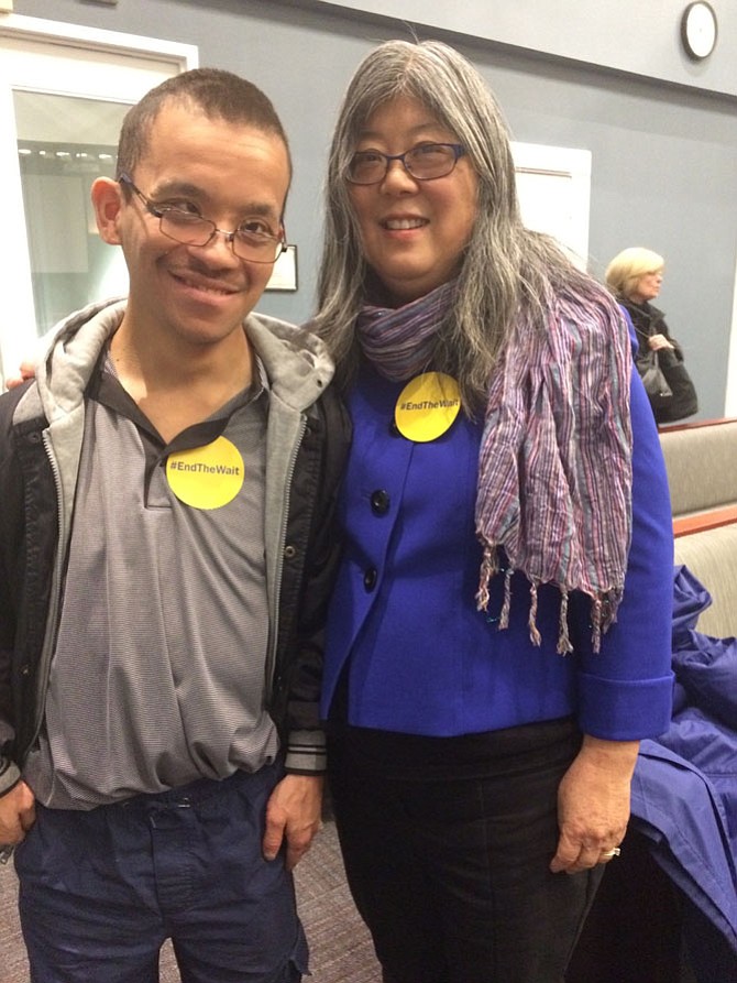 Pete Scampania, with his mother Shari Takimoto, asked state legislators during a Jan. 5 public hearing In Arlington to address the waiting list for Medicaid waivers.